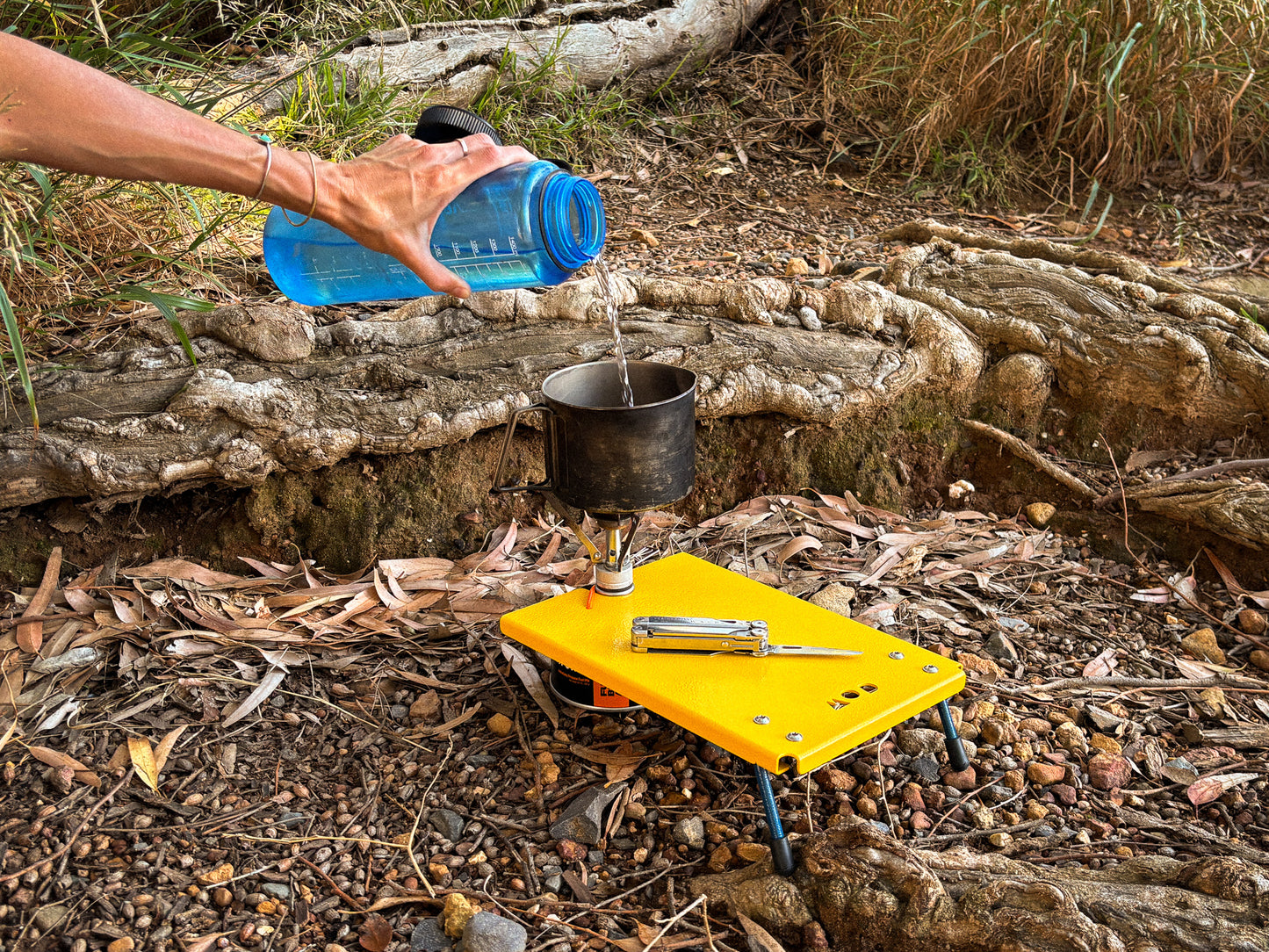 Camp Stove Table with gas canister and water pot camping