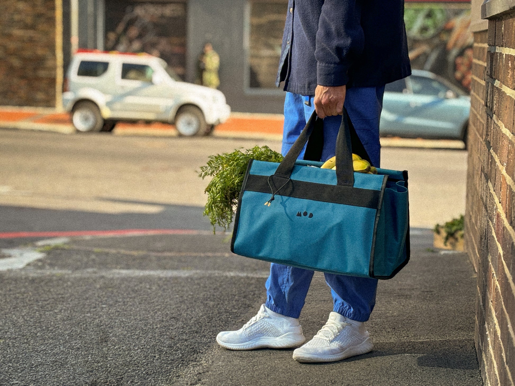 Cargo Tote in Teal being carried with groceries