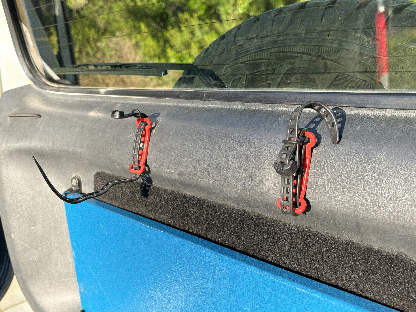 StrapOnz micro-cage cargo carrier in Red on Jimny 3 Rear Door 